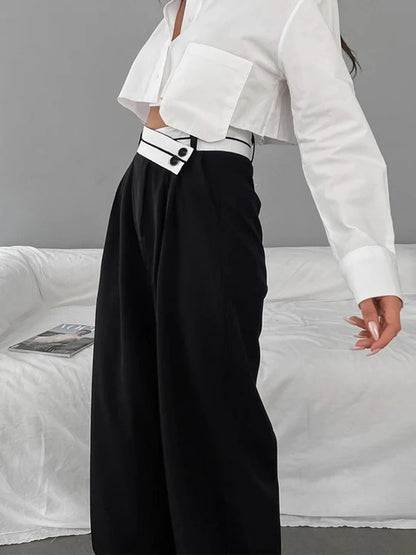 Pantalon asymétrique avec ceinture contrastée