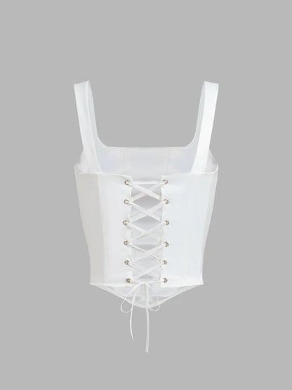 Top a corsetto legato con bagliore avorio